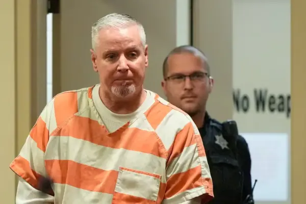 Sentenced to 15 years in prison, father whose son was involved in shooting that left four dead in the U.S.