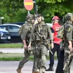 An attacker armed with a sword injures several people at a school in Sweden