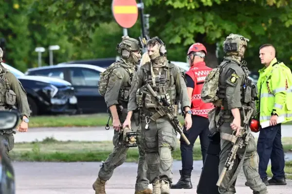 An attacker armed with a sword injures several people at a school in Sweden